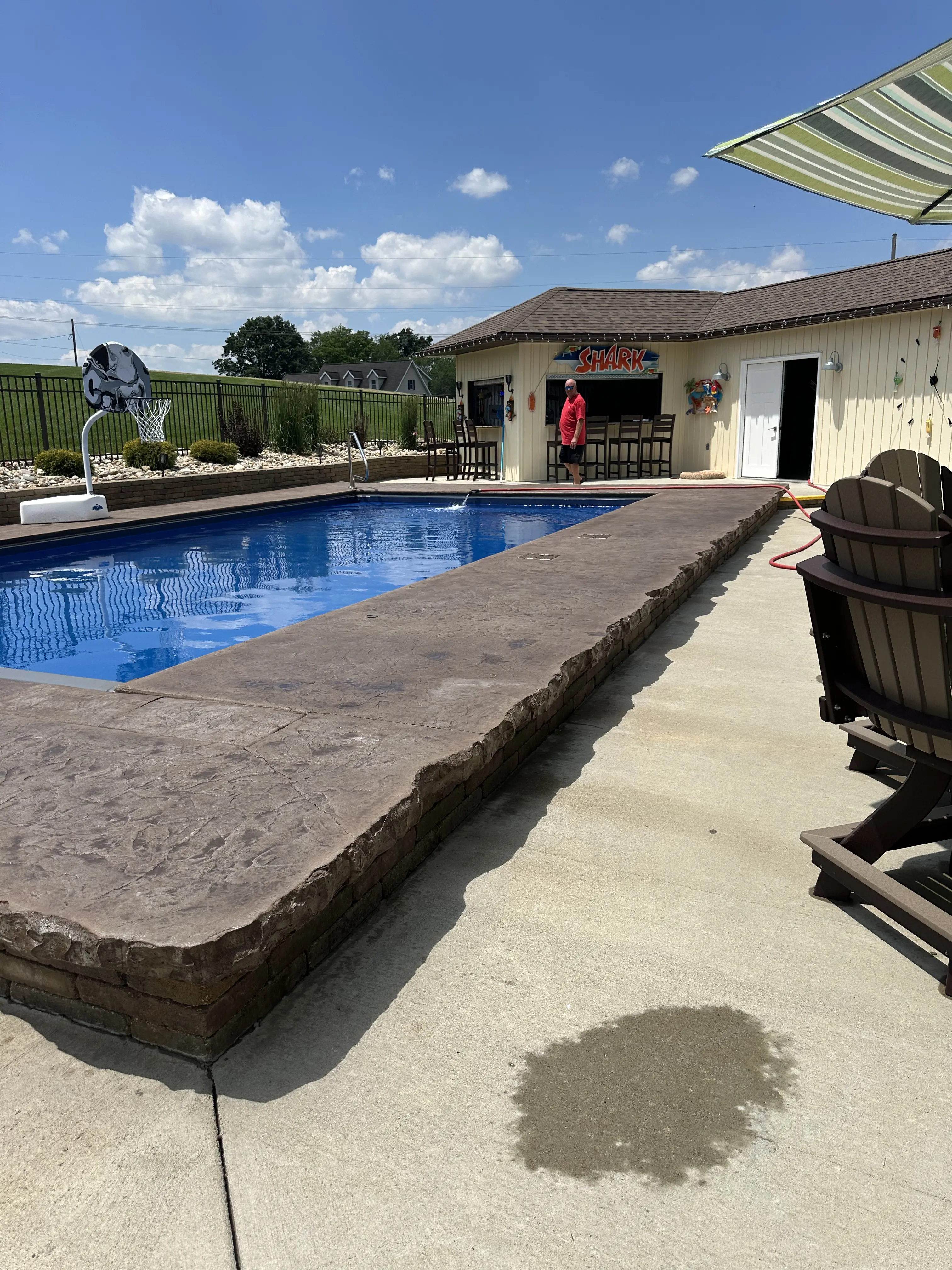 Pool deck with stamped concrete edge